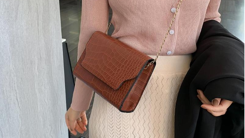 Lady with a brown Shoulder bag